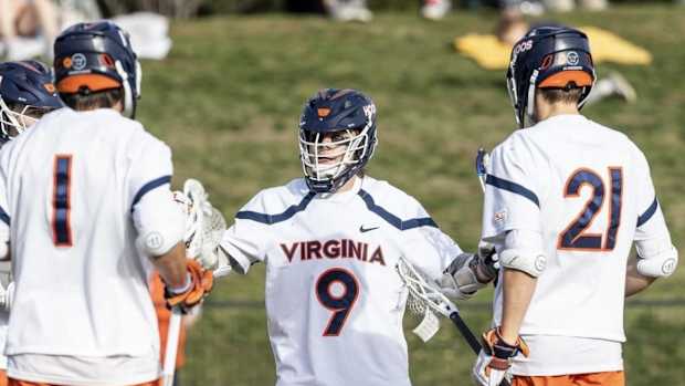 McCabe Millon celebrates after scoring a goal during the Virginia men's lacrosse game against Robert Morris at Klockner Stadium.